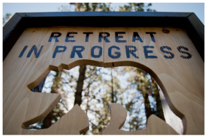 retreat in progress sign